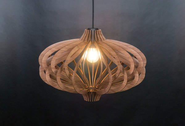 May include: A wooden pendant light with a unique, intricate design. The light is made of thin, curved pieces of wood that are arranged in a circular pattern. The light is lit and casts a warm glow.