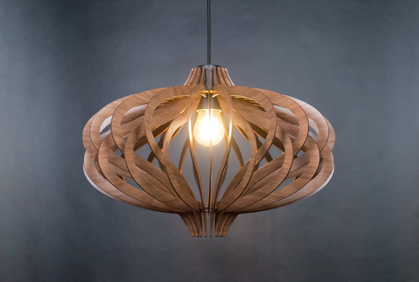 May include: A wooden pendant light fixture with a unique, intricate design. The light fixture is made of thin, curved pieces of wood that are arranged in a geometric pattern. The light fixture is illuminated by a single light bulb.