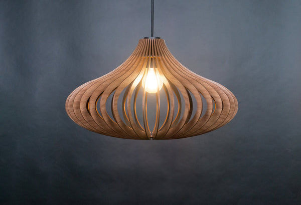May include: A wooden pendant light with a unique, organic shape. The light is made of thin strips of wood that are woven together to create a delicate and airy design. The light is suspended from a black cord and has a single light bulb in the center.