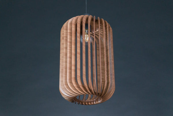 May include: A modern wooden pendant light fixture with a cylindrical shape and a light bulb inside. The fixture is made of thin, curved wooden slats that create a unique and stylish design.