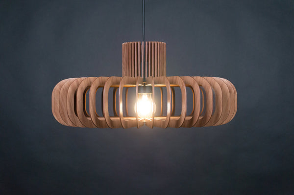 May include: A wooden pendant light fixture with a circular, layered design. The light fixture has a warm, natural wood finish and a single light bulb in the center.